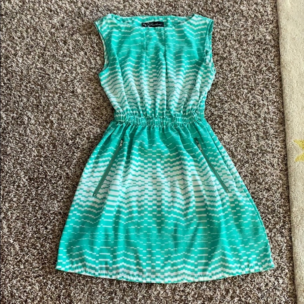 Green and white patterned dress